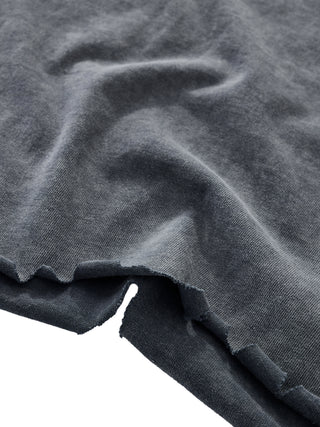Embrace the Chaos snow wash tee hem stitching detail