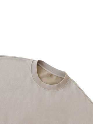 Paradigm crewneck in green front view with small geometric embroidery on chest