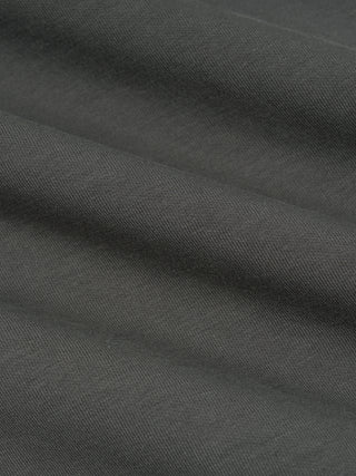 Macro of the dark gray 370 GSM heavyweight knit surface used on the vintage wash sleeveless hoodie.