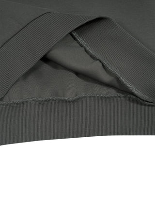Inside view of the kangaroo pocket and ribbed hem on a dark gray vintage wash sleeveless hoodie, showing the heavyweight knit.