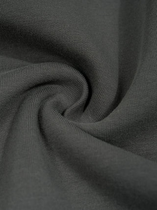 Swirl of the 370 GSM poly-cotton-spandex knit in dark gray, showing the weight and drape of the fabric.