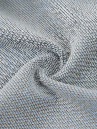 Close-up detail of the kangaroo pocket stitching on the 400 GSM mineral wash distressed hoodie