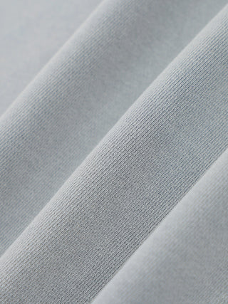 Close-up detail of the 400 GSM cotton mineral wash on the distressed hoodie