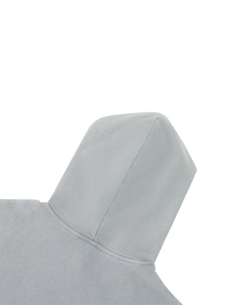 Close-up detail of the ripped and raw edge distressing on the 400 GSM mineral wash hoodie