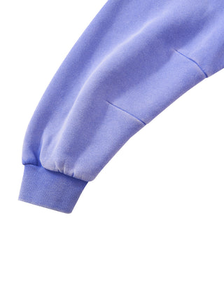 Sleeve and ribbed cuff detail of the PsySquatch boxy fleece hoodie in Purple, showing the vintage washed fleece and the cuff ribbing
