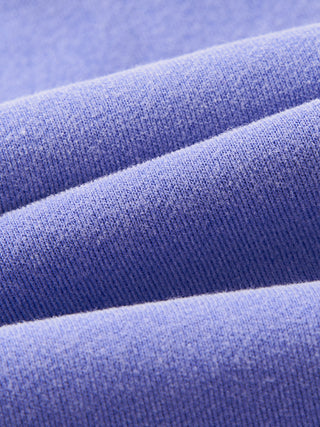 Folded stack of the 390 GSM fleece showing the outer face texture and the thickness of the PsySquatch boxy hoodie fabric in Purple