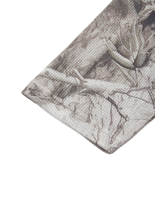 Cuff detail of the PsySquatch tree camo waffle long sleeve, showing the waffle texture and the camo print continuing to the sleeve opening