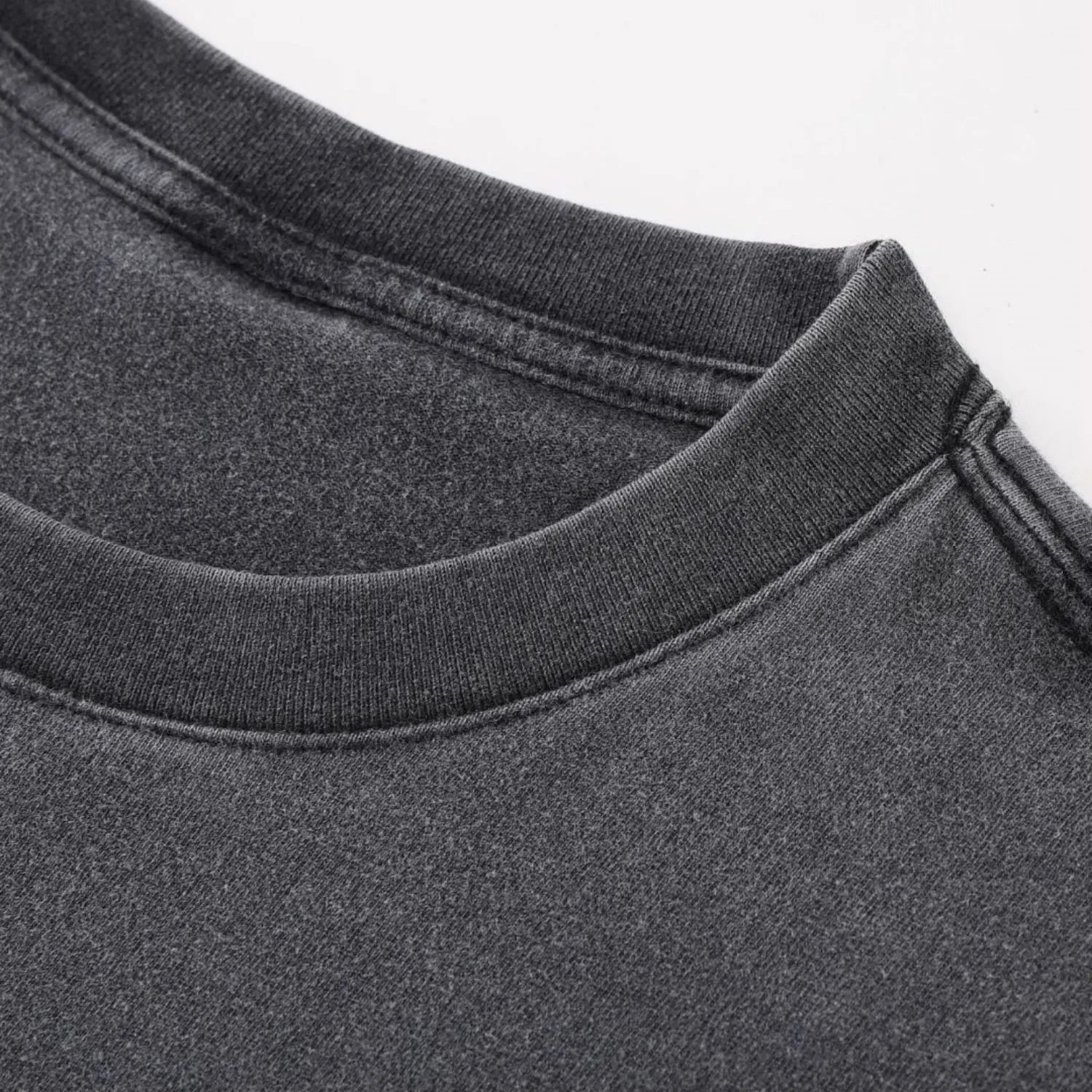 Close-up of Existential tee ribbed crew neck with reinforced double-stitch construction