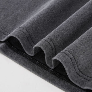 Interconnected charcoal vintage tee layered hem with clean stitching detail