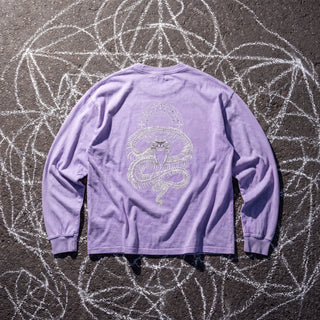 Back of the Ouroboros Gate acid wash oversized long sleeve tee in Purple, styled on dark asphalt covered in white chalk sacred geometry, showing a skeletal serpent coiled beneath a circular lattice gate.