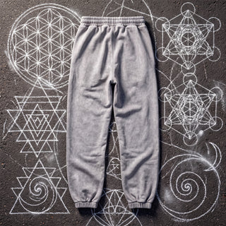 Back view of the Paradigm heavyweight snow wash joggers in cool Light Gray on chalk sacred geometry asphalt, showing the plain back, gathered elastic waistband and ribbed ankle cuffs.