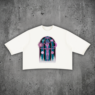 Dissolution of Ego mineral wash raw-hem sweater tee in white, heavyweight boxy cotton tee with psychedelic print on a concrete backdrop