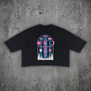 Dissolution of Ego mineral wash raw-hem sweater tee in black, 330 GSM heavyweight boxy cotton with psychedelic front print, styled on a concrete backdrop