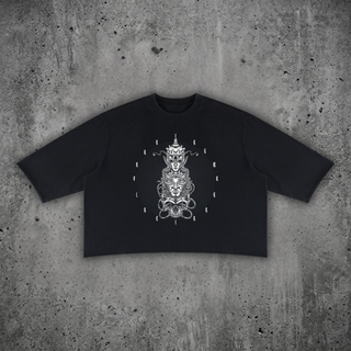 Paradigm mineral wash raw-hem sweater tee in black, 330 GSM heavyweight boxy cotton with psychedelic front print, styled on a concrete backdrop