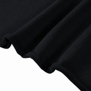 Close-up of the Cosmic Connection black mineral wash sweater tee showing the hand-cut raw hem and 330 GSM heavyweight cotton