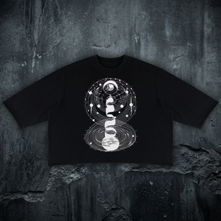 Cosmic Connection mineral wash raw-hem sweater tee in black, 330 GSM heavyweight boxy cotton with cosmic psychedelic print, styled on a concrete backdrop