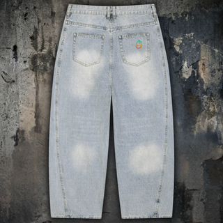 Light blue vintage wash barrel leg jeans with DMT.exe serpent artwork, styled product view