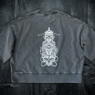 Paradigm mineral wash boxy raw-edge tee in gray blue, showing the drop-shoulder loose fit