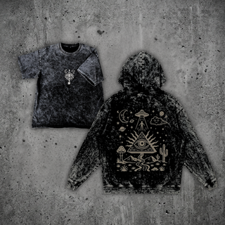 Mystic Signal Snow Wash Set by Phantasmagorical — snow-wash charcoal heavyweight tee with a small celestial chest print beside the matching pullover hoodie, back view, featuring a tan desert scene with an all-seeing pyramid, UFO, crescent moon, cacti and mushrooms.