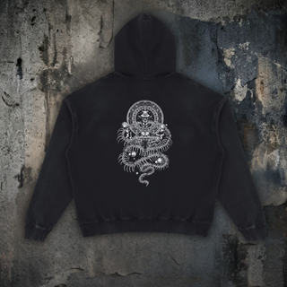 Back view of the DMT.exe distressed hoodie in Black, white line-art print of a seated figure in a geometric portal above a fanged skull and coiling snake skeletons