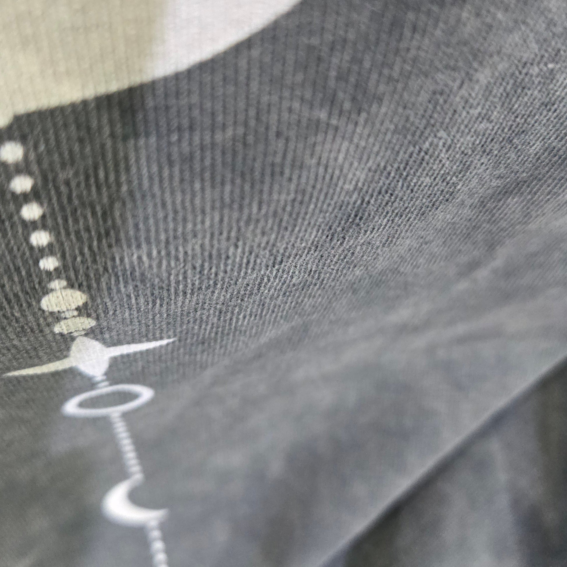 Existential snow wash tee hem stitching detail