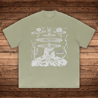 Gray green Spaced Out Absurdly Heavyweight tee with white surreal portrait head opening into orbital planes and cacti